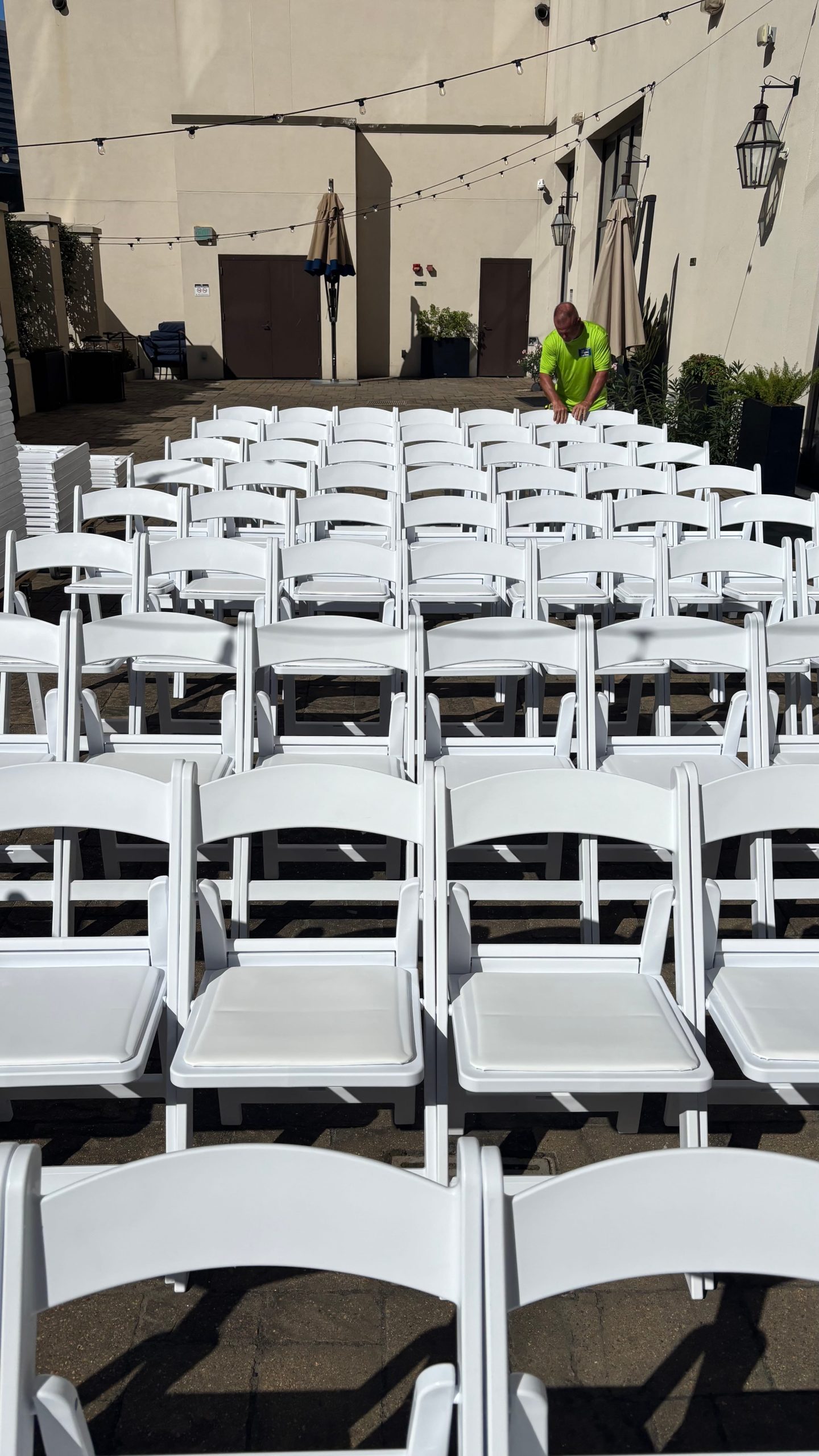 white chairs lined up in rows for event